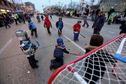 Street hockey prior to the Santa Claus Parade on Portage Avenue, Saturday, November 16, 2013. (TREVOR HAGAN/WINNIPEG FREE PRESS)