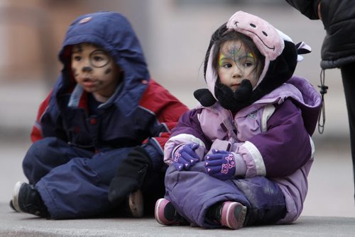 Logan Bancroft, 5, and his sister, Asia, 4, waiting for the Santa Claus Parade on Portage Avenue, Saturday, November 16, 2013. (TREVOR HAGAN/WINNIPEG FREE PRESS)