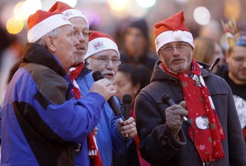 Men singing Christmas Carols at the Santa Claus Parade on Portage Avenue, Saturday, November 16, 2013. (TREVOR HAGAN/WINNIPEG FREE PRESS)