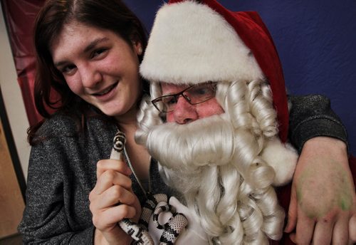 Adrienne Pereles brought her pet snake, Bones, to the Humane Society to get a photo with Santa who was in town for some special engagements the day after the Santa Claus Parade. 131117 - November 17, 2013 MIKE DEAL / WINNIPEG FREE PRESS