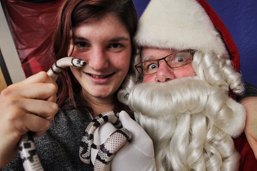 Adrienne Pereles brought her pet snake, Bones, to the Humane Society to get a photo with Santa who was in town for some special engagements the day after the Santa Claus Parade. 131117 - November 17, 2013 MIKE DEAL / WINNIPEG FREE PRESS