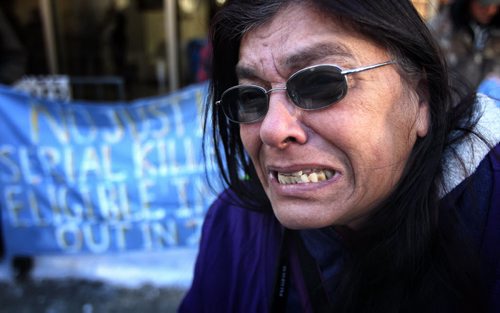 An emotional Gladys Radek speaks to the media as around one-hundred protesters gathered outside the Law Courts building at York Avenue and Kennedy Street over the lunch hour to protest injustices towards Aboriginal women. Gladys Radek is a national advocate of missing and murdered women whose niece, Tamara Chipman, disappeared in 2005 along Highway 16 in northern British Columbia. 131118 - November 18, 2013 MIKE DEAL / WINNIPEG FREE PRESS