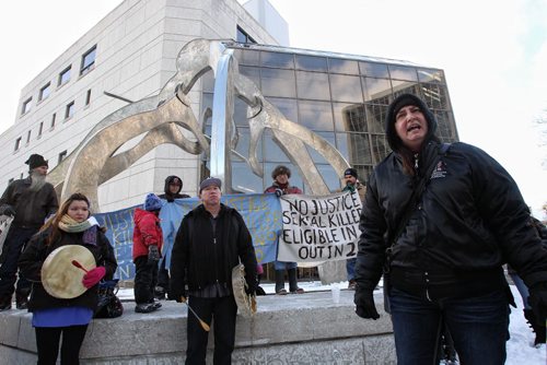 Organizer Shannon Buck (right) speaks to around one-hundred protesters who gathered outside the Law Courts building at York Avenue and Kennedy Street over the lunch hour to protest injustices towards Aboriginal women.  131118 - November 18, 2013 MIKE DEAL / WINNIPEG FREE PRESS