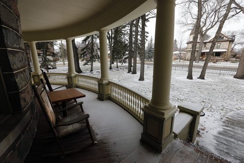 curved  front porch , with veiw of another historic stone house- Historic Morden  Stephen St. stone home  is up for sale built in 1902 Äì bill redekop story  Nov. 19 2013 / KEN GIGLIOTTI / WINNIPEG FREE PRESS