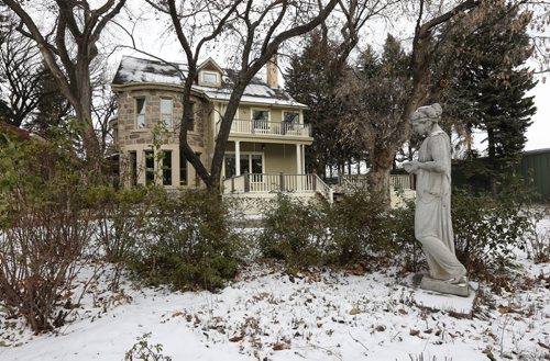 stately backyard  with statue  in garden - Historic Morden  Stephen St. stone home  is up for sale built in 1902 Äì bill redekop story  Nov. 19 2013 / KEN GIGLIOTTI / WINNIPEG FREE PRESS