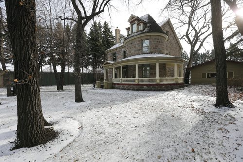 exterior , front  with sweeping circular turret   front with  porch deck - Historic Morden  Stephen St. stone home  is up for sale built in 1902-  Äì bill redekop story  Nov. 19 2013 / KEN GIGLIOTTI / WINNIPEG FREE PRESS
