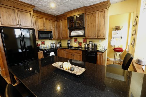 modern kitchen with granie counter tops -Historic Morden  Stephen St. stone home  is up for sale built in 1902 Äì bill redekop story  Nov. 19 2013 / KEN GIGLIOTTI / WINNIPEG FREE PRESS