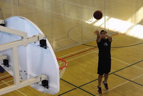 Canstar Community News Jed Delapaz, a three-year member at the Wellness Institute medical fitness facility at Seven Oaks General Hospital, sinks a shot on one of the facility's basketball courts.