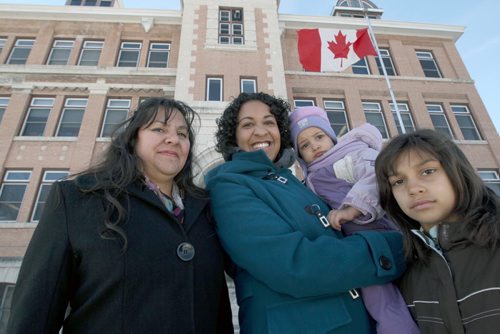 L to R Eugenia Lehmann, Kathy Heppner, with Elena Heppner, 2years, and Kezia Heppner standing outside Earl Grey School as backdrop- They are lobbying to get a Spanish Immersion school set up in Winnipeg See Nick Martin story- Oct 30, 2013   (JOE BRYKSA / WINNIPEG FREE PRESS)