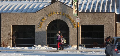 Student leave Van Walleghem school in Linden Woods THursday afternoon. Pembina Trails Schood Division considers recent changes to city snow clearing dangerous for kids  in this sidewalk free neighborhood. See story. November 21, 2013 - (Phil Hossack / Winnipeg Free Press)