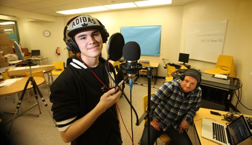 In Photo - Dahlen Barron  a grade 10 student taking part in recording program with local rapper Pip Skid, who has been mentoring Barron  and other students over the past few months to record their own rap music.   Quinn spearheads "Living in the City,"  is a Manitoba Arts Council and Louis Riel School Division joint funded program that puts together three local artists with students in the Division's Transition for Success (TFS) program at the Rene Deleurme Centre, an alternative high school. The kids in the program are recording some original rap tracks with local rapper Pip Skid, who has been mentoring them over the past few months.  November 21, 2013 Ruth Bonneville / Winnipeg Free Press