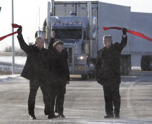 From right, Prime Minister Stephen Harper,Diane Gray, CentrePort's president and CEO and Premier Greg Selinger opened the first section of the new CentrePort Canada Expressway in Winnipeg Friday. CentrePort is the 8,093-hectare inland port and transportation hub being developed northwest of the airport. Wayne Glowacki / Winnipeg Free Press Nov. 22. 2013