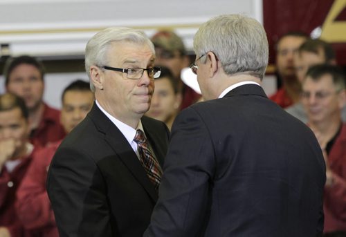 At left, Premier Greg Selinger and Prime Minister Stephen Harper at the event at Fort Garry Fire Trucks Ltd. in Winnipeg Friday morning after the opening of the first section of the new CentrePort Canada Expressway . Bruce Owen/Martin Cash stories   Wayne Glowacki / Winnipeg Free Press Nov. 22. 2013