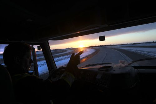 Driving instructor Gord McKay, with Bison Transport, drives the CentrePort Expressway for the first time Friday during rush hour. November 22, 2013  Joe Bryksa / Winnipeg Free Press