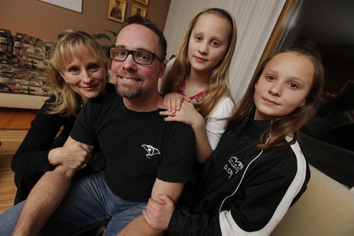 November 24, 2013 - 131124  -  Nadia and Tom Chaput with their daughters Tamara and Oksana, who are involved with Manta Swim Club and volunteer with Operation Red Nose, are photographed Sunday, November 24, 2013. John Woods / Winnipeg Free Press