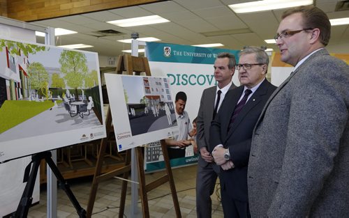 BIZ -  University of Winnipeg Commons  , residential complex LtoR James Allum Minister of  Education and Advanced Learning  , Lloyd Axworthy UofW  President , and Peter Bjornson  Minister of Housing and  Community Development look over drawings of the new building -  The University of Winnipeg and the Province of Manitoba are unveiling plans to build a new 14-storey residential complex on the parking lot between the Buhler Centre and the Art Gallery. It apparently will be a mix of low-cost housing units and regular rental units.Ä®- story by Murray McNeill   Nov. 25 2013 / KEN GIGLIOTTI / WINNIPEG FREE PRESS