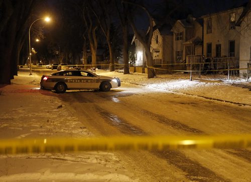 Wpg Police are investigating an overnight shooting in the area of Pritchard Ave  just west of  Powers , the street is completly blocked  by a single police car and police tape . Male shot . Nov. 26 2013 / KEN GIGLIOTTI / WINNIPEG FREE PRESS