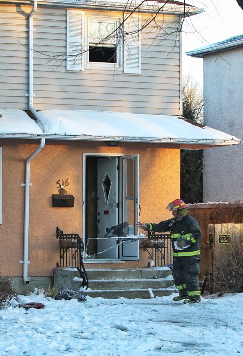 A house fire at 516 Cordova Street sent at least one person to the hospital Tuesday afternoon.  131126 November 26, 2013 Mike Deal / Winnipeg Free Press