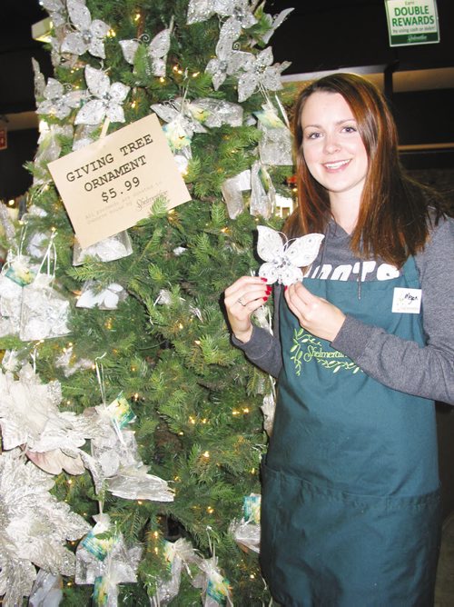 Canstar Community News Nov. 20, 2013 - Megan Parker holds one of the holiday ornaments being sold at Shelmerdine Garden Centre to raise money for Osborne House. (ANDREA GEARY/CANSTAR COMMUNITY NEWS)