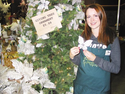 Canstar Community News Nov. 20, 2013 - Megan Parker shows off the holiday ornament being sold at Shelmerdine Garden Centre to raise money for Osborne House. (ANDREA GEARY/CANSTAR COMMUNITY NEWS)