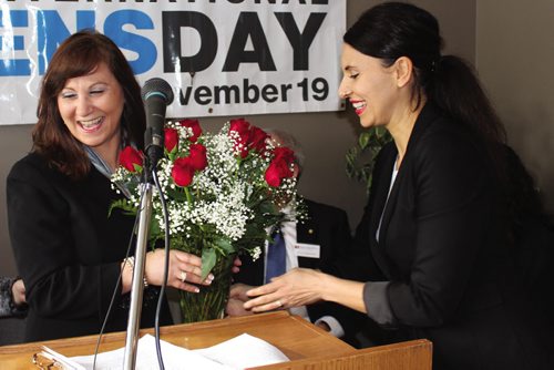 Canstar Community News Just prior to making some closing remarks at the grand opening of the Men's Resource Centre of Manitoba, Suhad Bisharat is presented with a boquet of roses on behalf of her staff. (JORDAN THOMPSON)