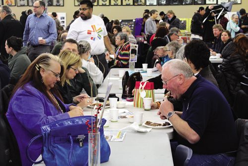 Canstar Community News Attendees dig in at the 17th annual Wild Blueberry Pancake Breakfast. (JORDAN THOMPSON)