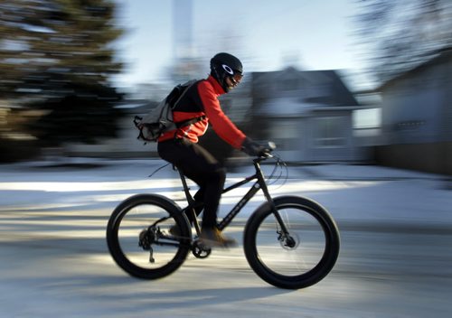 49.8 - PULSE - winter cycling tips..  J.C. Carson a Woodcock Cycle Works sales rep. and winter cyclist, he is riding one of the stores "fat bikes".  Geoff Kirbyson story. Wayne Glowacki / Winnipeg Free Press Nov. 26. 2013