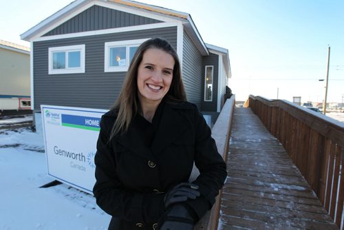 U of M medical student Gail Pollard was just one of the many faculty students that helped build this Habitat for Humanity home at the U of M campus over the summer.  Pollard is all smiles as she attends the reception where the keys are handed over to the family at 882 McCalman avenue Tuesday.   See Carol's story. Nov 26,, 2013 Ruth Bonneville / Winnipeg Free Press