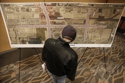 November 26, 2013 - 131126  -  A member of the public checks out a map of proposed changes to the St James Street/Ellice Avenue area at a Polo Park area infrastructure improvement open house Tuesday, November 26, 2013. John Woods / Winnipeg Free Press