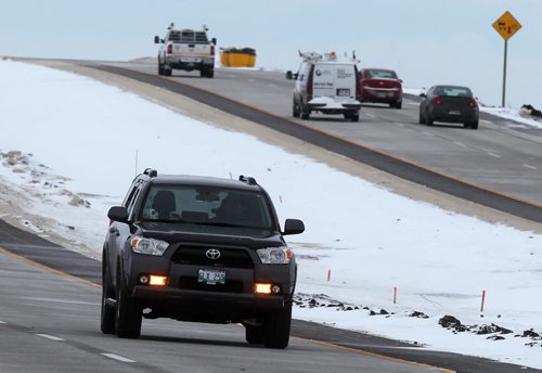 Traffic along the Centerport highway on Winnipeg's West perimeter Wednesday. See story re-Traffic Cams. November 27, 2013 - (Phil Hossack / Winnipeg Free Press)