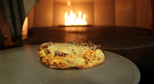 Tarte Flambe Pizza also called Northern French Pizza.  Basic pizza dough, bacon, caramelized onions, cheese and cooked in a pizza oven.   49.8  Nov 27,, 2013 Ruth Bonneville / Winnipeg Free Press