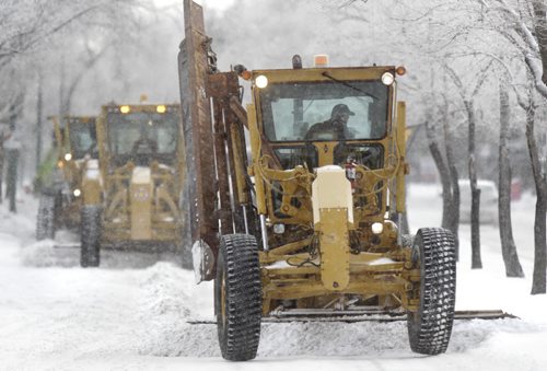 On Thursday, graders scrape Westwood Drive that is a designated  a snow route.  Wayne Glowacki / Winnipeg Free Press Nov. 26. 2013