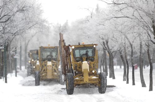 On Thursday, graders scrape Westwood Drive that is a designated  a snow route.  Wayne Glowacki / Winnipeg Free Press Nov. 26. 2013