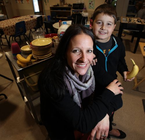 Robyn Avery and her seven-year-old son, Nathan.¤Robyn's daycare has a hot lunch program that focuses on good nutrition. While Robyn doesn't necessarily agree with everything in the Food Guide, her daycare follows it when preparing meals and snacks. She uses common sense to ensure her daycare kids--and her own family--get their share of healthy, less refined foods.¤ Shamona Harnett story. November 28, 2013 - (Phil Hossack / Winnipeg Free Press)