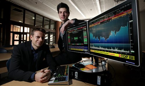 This weekend's Money Matters is a do-it-yourself investment tips list, featuring two young investors who have taken DIY'ing to the next level. One is using the proceeds of his investments to fund his university and support his young family, while the other, 18, recently graduated high school and spends hours a day successfully trading in the stock and foreign currency exchange markets Nathan Moncrief (left) and Josh Olfert pose at the Asper School of Business at the U of W Friday. See Money MakeOver November 2, 2013 - (Phil Hossack / Winnipeg Free Press)