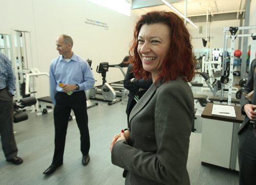 Healthy Living and Seniors Minister Sharon Blady tours the gym available to employees at National Leasing after a press conference for the official launch of Wellness Works, a campaign to encourage health and wellness at workplaces Nov 29,, 2013 Ruth Bonneville / Winnipeg Free Press