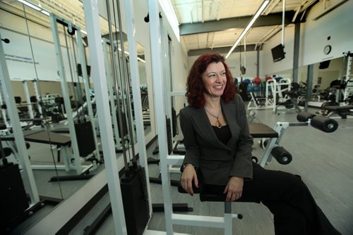 Healthy Living and Seniors Minister Sharon Blady tours the gym  and its facilities available to employees at National Leasing after a press conference for the official launch of Wellness Works, a campaign to encourage health and wellness at workplaces Nov 29,, 2013 Ruth Bonneville / Winnipeg Free Press