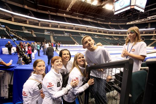 Jennifer Jones team poses for a picture for a young curling fan at  MTS Centre Saturday just after a practice session  for TIm Hortons Roar of the Rings Canadian Curling Trials which starts Sunday at MTS Centre.   Nov 30, 2013 Ruth Bonneville / Winnipeg Free Press