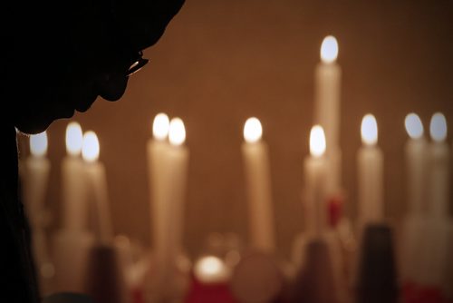 December 1, 2013 - 131201  - A man lowers his head during a candlelight vigil against tragic events taking place in Saudi Arabia to Ethiopian people, including torturing children, at the Ethiopian Society of Winnipeg, Sunday, December 1, 2013. John Woods / Winnipeg Free Press