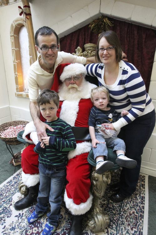 Sensitive Santa at an Autism Society of Manitoba hosted event at Polo Park Shopping Centre early Sunday morning. Evan Boszko, 5, and his brother Zackary, 18 months, with parents Michale and Lori (right) need the extra time that the Autism Society event offers to get comfortable with Santa before getting their photo taken. 131201 - Sunday, December 01, 2013 -  (MIKE DEAL / WINNIPEG FREE PRESS)