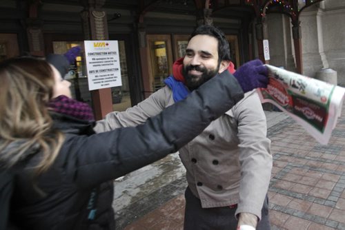 At right,   Arié Moyal on his Hug Train 5 cross country train trip arrived in Winnipeg Monday morning for a short stop and gives a hug to Melissa Flores outside the Union Station. Aria carries a pink sign with the words Free Hugs, his goal is to raise awareness and funds for the Canadian Mental Health Association and brighten spirits during the holidays.  Wayne Glowacki / Winnipeg Free Press Dec.2 2013