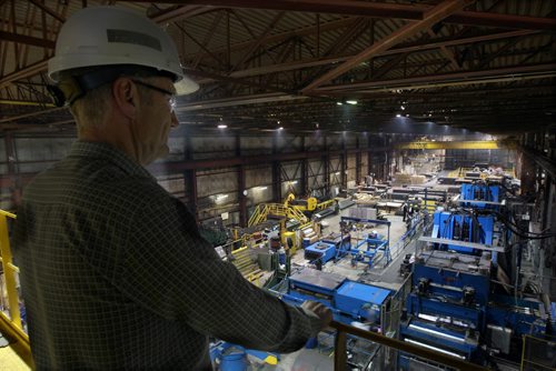 Terry Vanstone of Russel Metals on St James St in Winnipeg looks over at the companies new high yield stretch leveler- the first in Western Canada- See Martin Cash story- Dec 02, 2013   (JOE BRYKSA / WINNIPEG FREE PRESS)