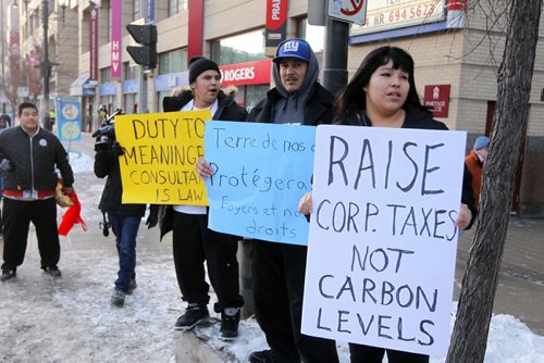 Some fracking protestors on Portage Ave. NO IDS GIVEN.  BORIS MINKEVICH / WINNIPEG FREE PRESS  December 2, 2013