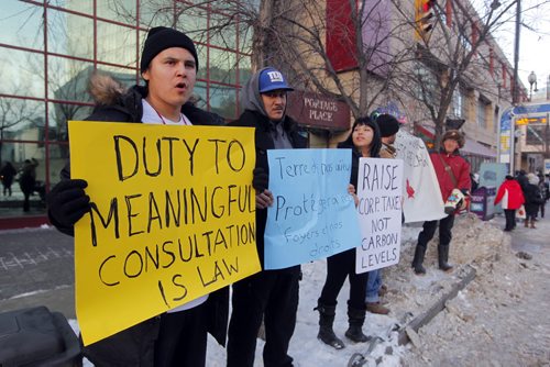 Some fracking protestors on Portage Ave. NO IDS GIVEN.  BORIS MINKEVICH / WINNIPEG FREE PRESS  December 2, 2013