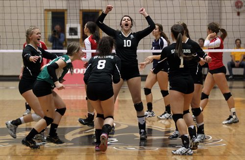 Neelin Spartans #10 rally's her team as they win their second of the first three sets against MBCI Hawks Monday night in AAAA playoff action at the U of M. THe Brandon team though went down three to five sets.  See story. December 2, 2013 - (Phil Hossack / Winnipeg Free Press)