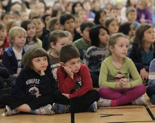 Students listen to Manitoba Education and Advanced Learning Minister James Allum in the gym at École Robert Browning Tuesday morning for an announcement on the province's smaller classes initiative. For Nick Martin story. Wayne Glowacki / Winnipeg Free Press Dec.3 2013