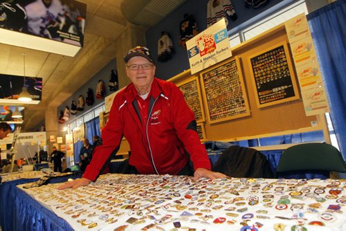 Keith Forbes with his pin selling area at the MTS Centre Roar of the Rings. BORIS MINKEVICH / WINNIPEG FREE PRESS  December 3, 2013