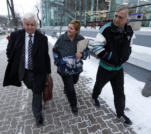 Law Courts , Animal hoarding  case involving animal abusers Peter and Judith Chernecki, plead guilty to animal hoarding  leave court with lawyer (left) Jay Prober -Dec. 3 2013 / KEN GIGLIOTTI / WINNIPEG FREE PRESS