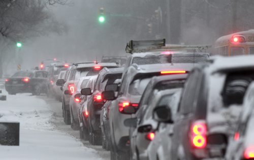 With the snowfall there was no rushing in the morning commute in Winnipeg like this traffic back up on Henderson Hwy. Wednesday morning. Wayne Glowacki / Winnipeg Free Press Dec.4 2013