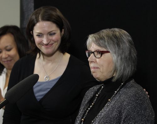 At right, Cancer survivor Marnie Ackerman and  Erin Selby, Health Minister at the announcement of the  Urgent CancerCare Clinic in the CancerCare Manitoba building Wednesday morning. See supplied photos of the clinic/ Kevin Rollason story Wayne Glowacki / Winnipeg Free Press Dec.4 2013